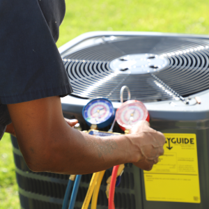 NAM staff member preforms essential summer maintenance at St. Charles Villas in Birmingham, Alabama